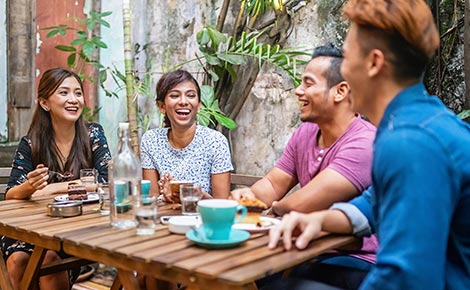 Group of four friends at a cafe.